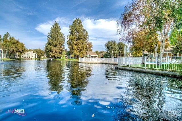 water view featuring fence