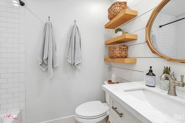 bathroom with shower / washtub combination, toilet, and vanity