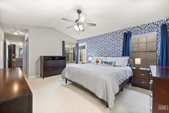 501 Reed St, Bakersfield, CA 93314 - bedroom featuring vaulted ceiling, multiple windows, light carpet, wallpapered walls, and baseboards