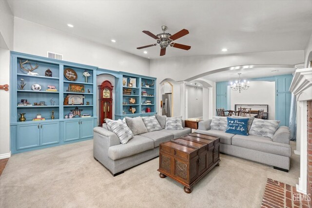 501 Reed St, Bakersfield, CA 93314 - living room with arched walkways, ceiling fan, a chandelier, recessed lighting, and light carpet