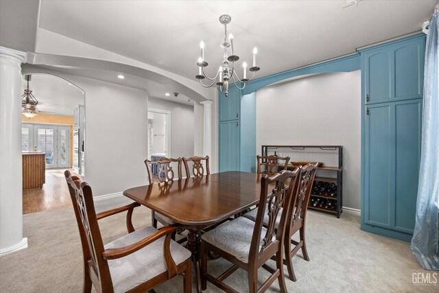 501 Reed St, Bakersfield, CA 93314 - dining space featuring arched walkways, light colored carpet, ornate columns, baseboards, and recessed lighting