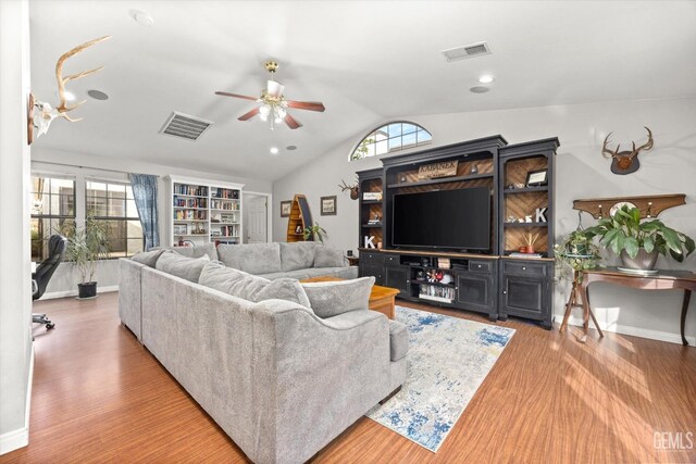501 Reed St, Bakersfield, CA 93314 - living room featuring a ceiling fan, vaulted ceiling, wood finished floors, and baseboards