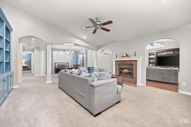 501 Reed St, Bakersfield, CA 93314 - living room featuring light carpet, ceiling fan, lofted ceiling, decorative columns, and arched walkways