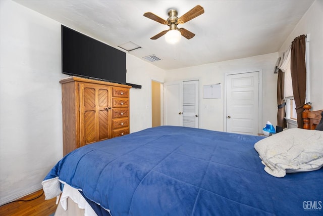 902 El Tejon Ave, Bakersfield, CA 93308 - bedroom with wood finished floors, ceiling fan, and multiple closets