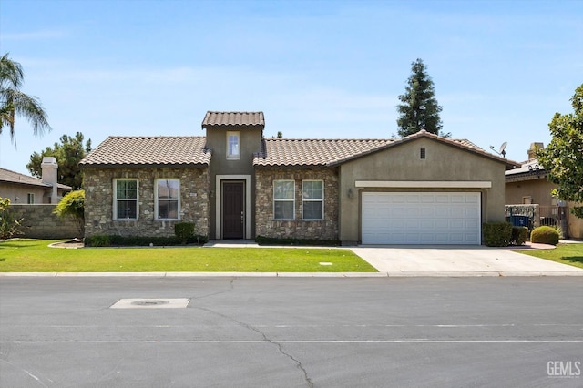 mediterranean / spanish-style home featuring a garage and a front lawn