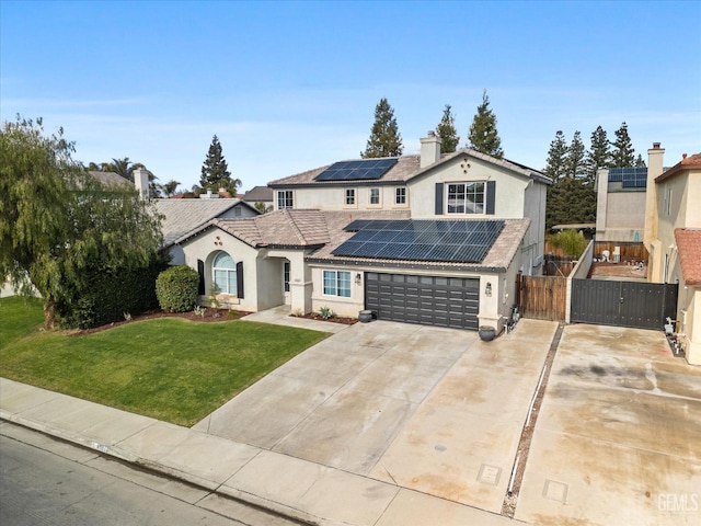 view of front facade featuring a front yard and solar panels