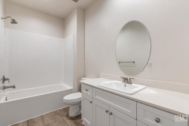11001 Arundel Way, Bakersfield, CA 93311 - bathroom featuring wood finished floors, toilet, vanity, and bathing tub / shower combination