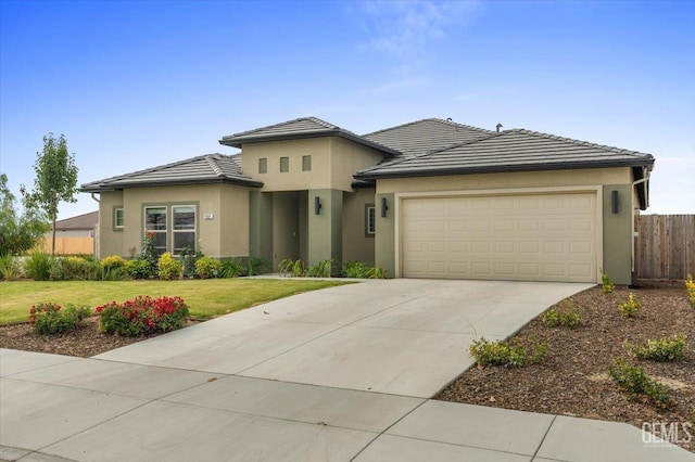 11001 Arundel Way, Bakersfield, CA 93311 - prairie-style house with an attached garage, stucco siding, and concrete driveway