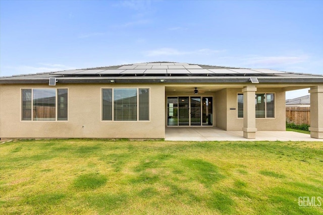 11001 Arundel Way, Bakersfield, CA 93311 - back of house with ceiling fan, a patio area, solar panels, and stucco siding