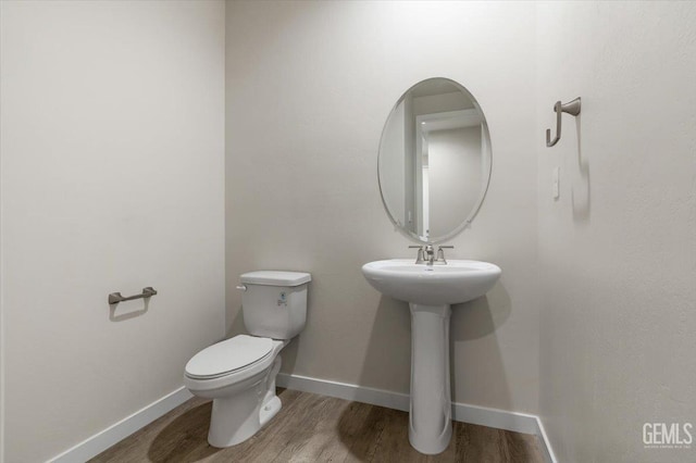 11001 Arundel Way, Bakersfield, CA 93311 - bathroom with wood finished floors, toilet, and baseboards