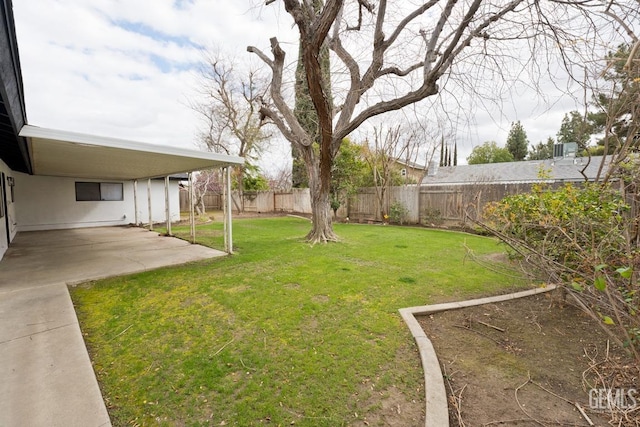 view of yard featuring a patio area and a fenced backyard