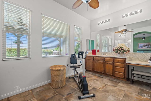 6315 Veronese Ct, Bakersfield, CA 93306 - bathroom featuring a ceiling fan, stone finish flooring, and healthy amount of natural light