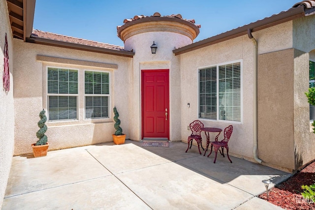 6315 Veronese Ct, Bakersfield, CA 93306 - entrance to property with stucco siding, a patio area, and a tiled roof