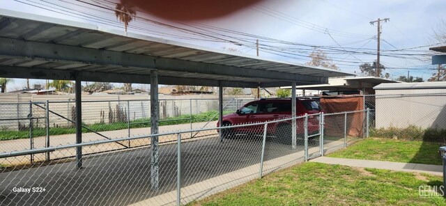 view of car parking with fence
