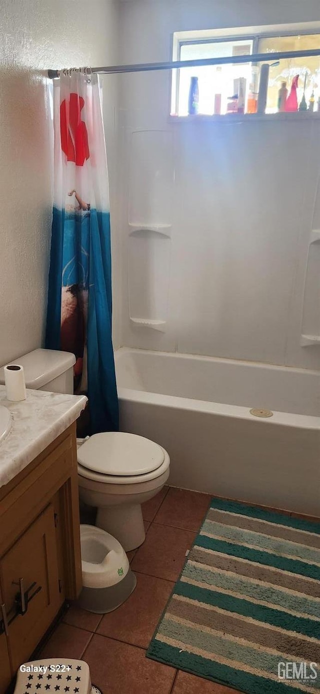 full bathroom with tile patterned flooring, toilet, vanity, and shower / bath combo
