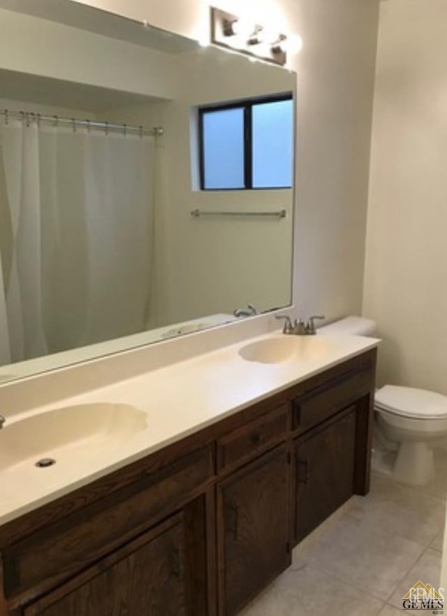 2912 Lum Ave, Bakersfield, CA 93304 - bathroom featuring double vanity, tile patterned floors, and a shower with curtain