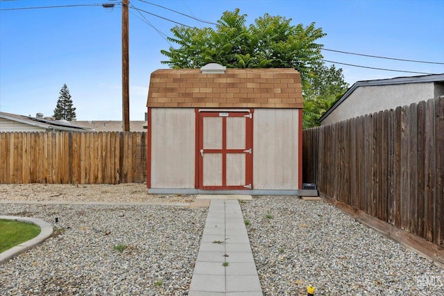 view of shed featuring a fenced backyard