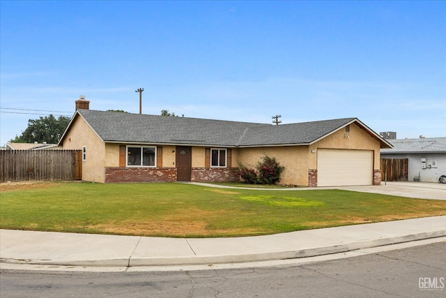 ranch-style house with a garage, fence, driveway, and a front yard