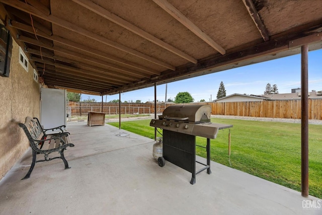 view of patio with a fenced backyard and grilling area