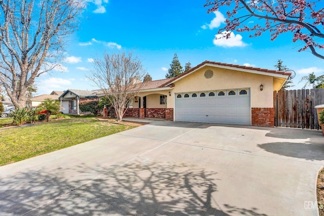 ranch-style house featuring brick siding, stucco siding, an attached garage, a front yard, and fence