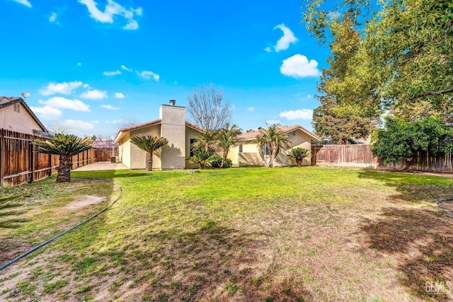 view of yard with a fenced backyard