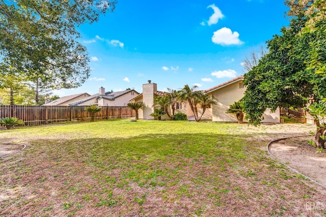 view of yard with a fenced backyard