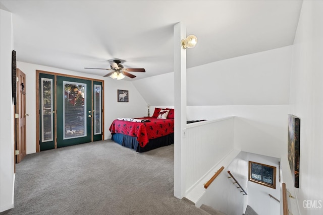 carpeted bedroom with a ceiling fan, access to outside, and vaulted ceiling