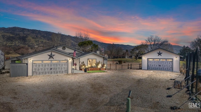 ranch-style home featuring a mountain view and a garage