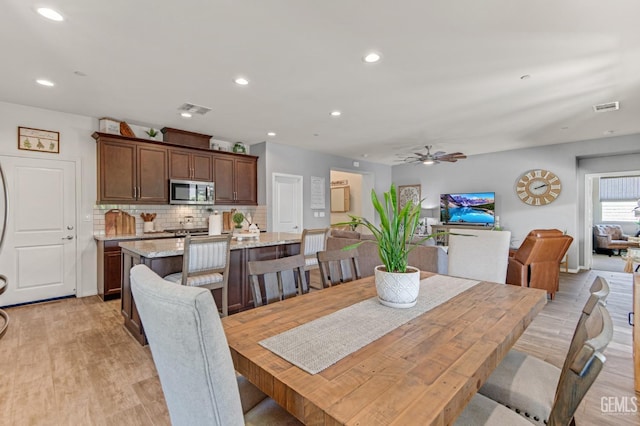 dining area with recessed lighting, ceiling fan, visible vents, and light wood-style flooring