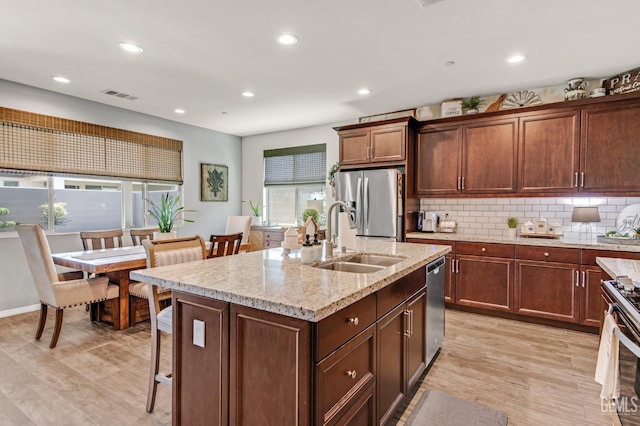 kitchen featuring recessed lighting, appliances with stainless steel finishes, a sink, and visible vents