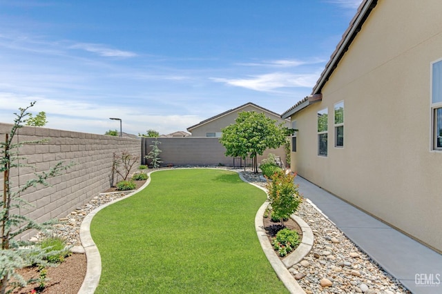view of yard featuring a fenced backyard
