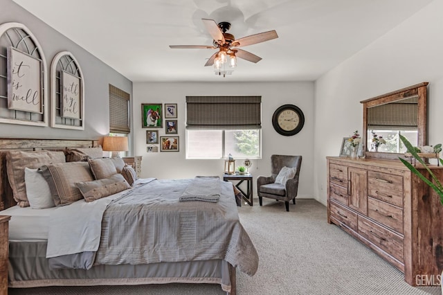bedroom with ceiling fan and carpet flooring