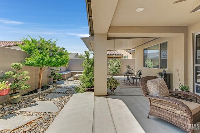 view of patio / terrace with a fenced backyard and ceiling fan