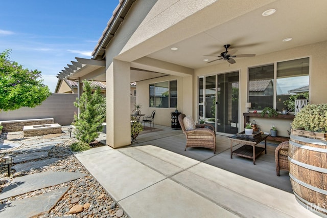view of patio / terrace featuring ceiling fan and fence