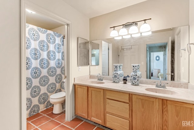 bathroom featuring tile patterned floors, vanity, toilet, and a shower with curtain