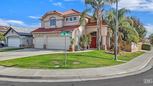 mediterranean / spanish-style house with a front lawn and a garage