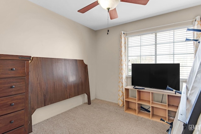 bedroom with light colored carpet and ceiling fan