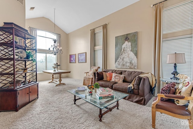 carpeted living room with vaulted ceiling and a notable chandelier