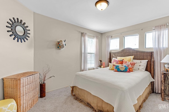 bedroom with light carpet