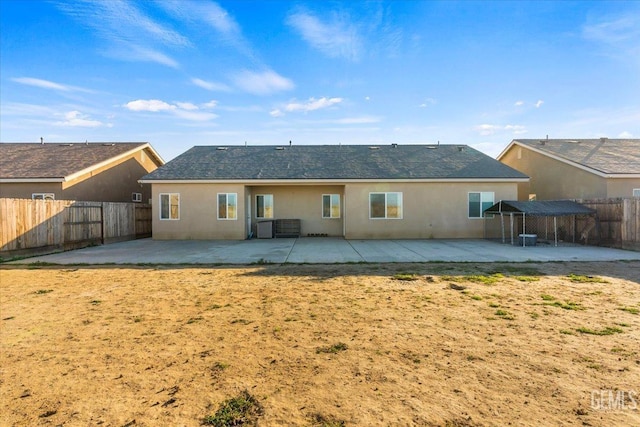 back of property with a patio