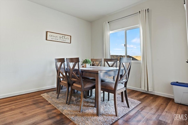 dining room with dark wood-type flooring