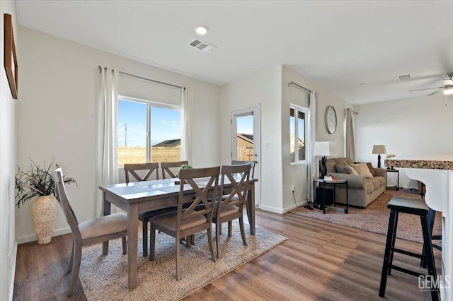 dining area featuring ceiling fan and hardwood / wood-style floors