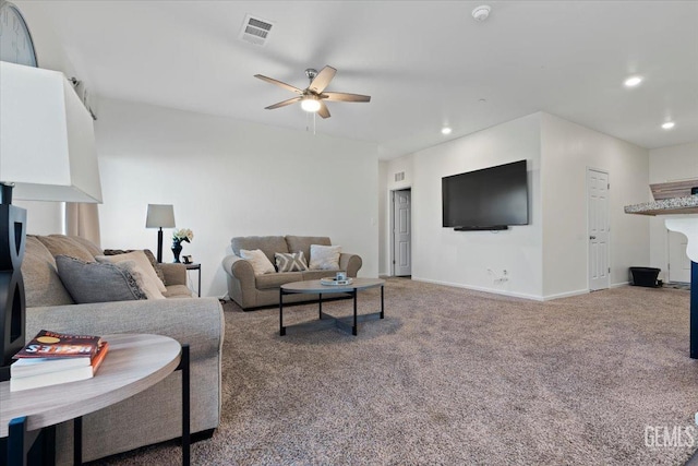 carpeted living room featuring ceiling fan