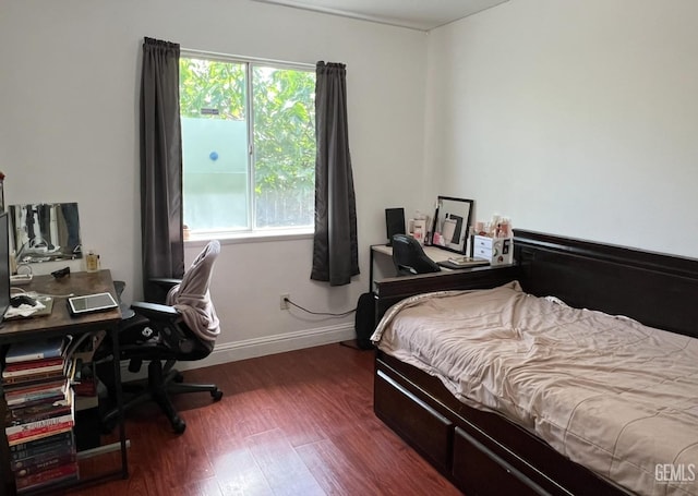 1941 Vassar St, Delano, CA 93215 - bedroom featuring multiple windows, wood finished floors, a desk, and baseboards