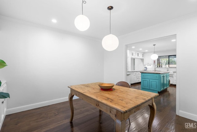 dining space featuring crown molding, recessed lighting, dark wood finished floors, and baseboards