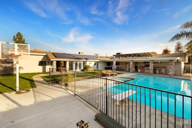 view of swimming pool with a fenced in pool, an in ground hot tub, fence, a patio area, and a diving board