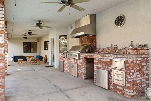 view of patio / terrace featuring an outdoor kitchen, a sink, and area for grilling