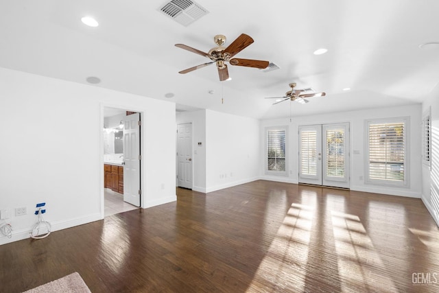 unfurnished living room featuring baseboards, visible vents, wood finished floors, french doors, and recessed lighting