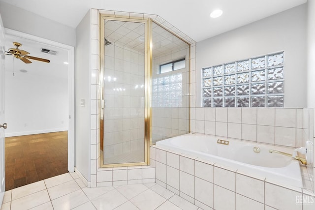 full bath featuring visible vents, a ceiling fan, a shower stall, a bath, and tile patterned floors