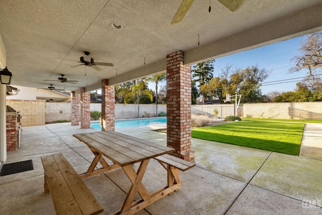 view of patio / terrace featuring a ceiling fan, a fenced in pool, and a fenced backyard